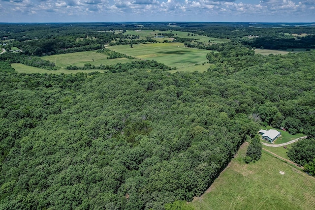 aerial view featuring a wooded view