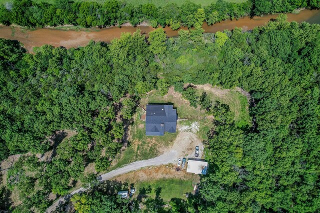 aerial view featuring a wooded view