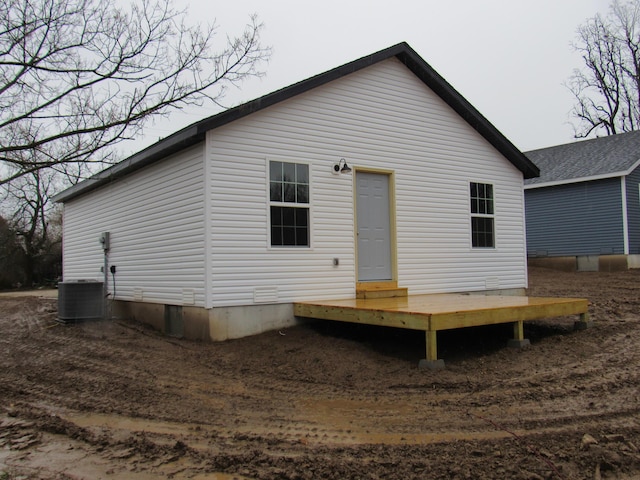 back of property with central AC