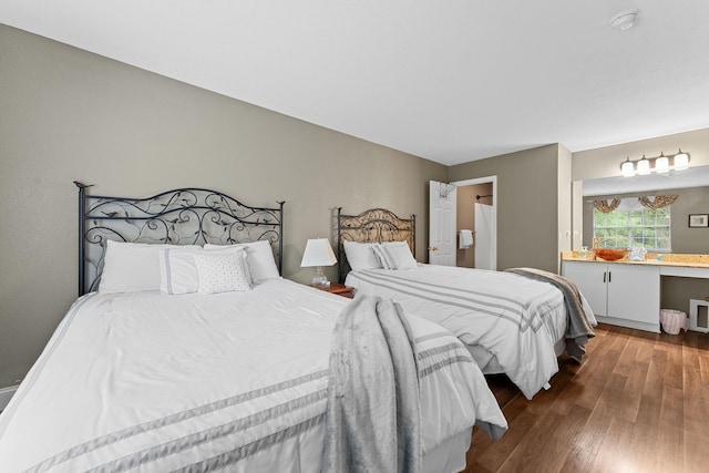 bedroom with hardwood / wood-style floors