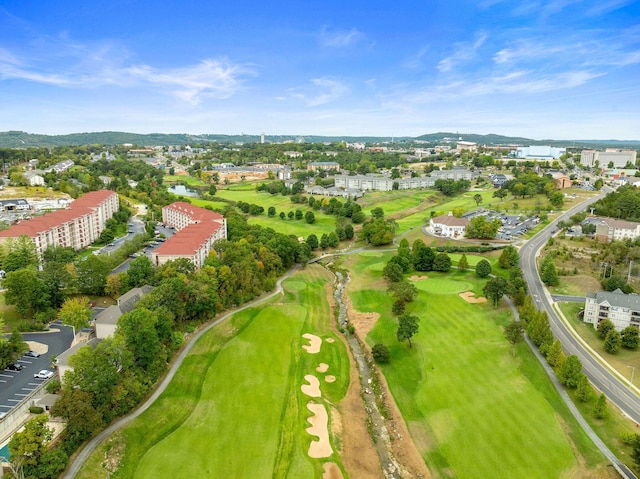 birds eye view of property featuring a water view and view of golf course