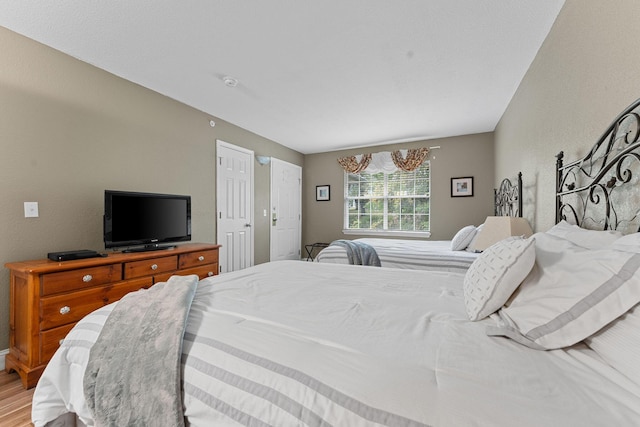 bedroom featuring wood finished floors