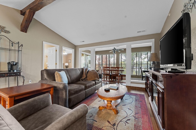 living room with visible vents, dark wood-style flooring, ceiling fan, and vaulted ceiling with beams