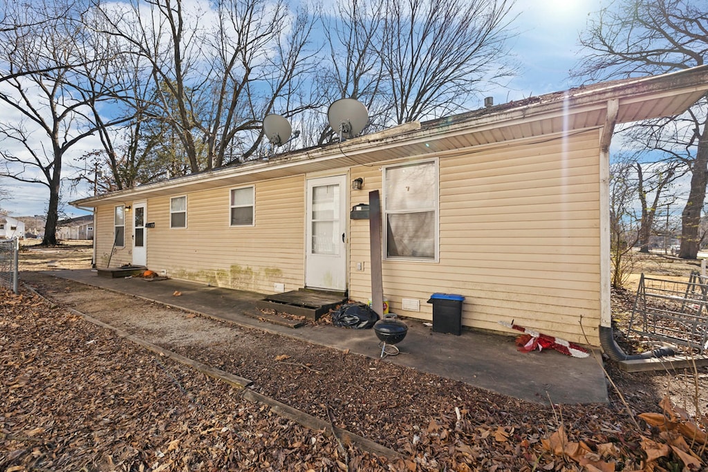 1218 N Rogers Ave, Springfield, MO 65802 - rear view of house with entry steps