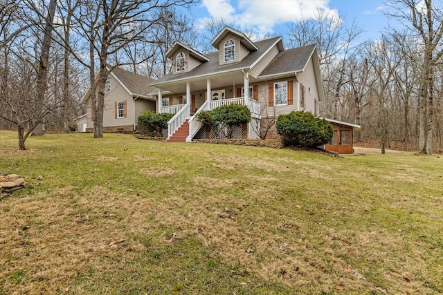 view of front of property featuring a shingled roof, stairs, a porch, and a front yard