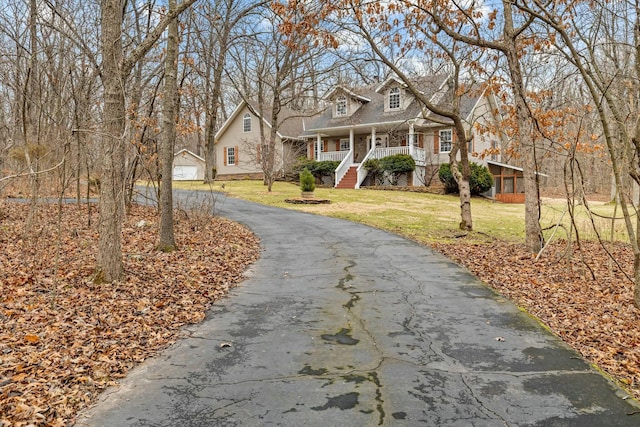 view of front of home featuring a porch and a front lawn