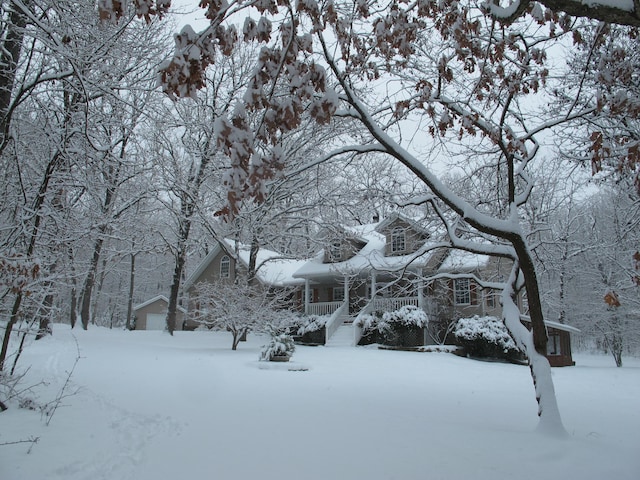 exterior space with a garage and covered porch