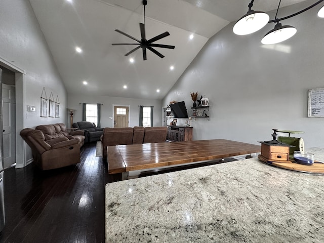 living room featuring dark wood-type flooring, recessed lighting, high vaulted ceiling, and a ceiling fan