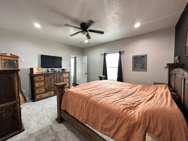 bedroom featuring a textured ceiling, recessed lighting, carpet floors, a ceiling fan, and baseboards