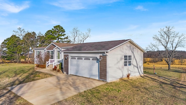 ranch-style home with a garage, concrete driveway, and a front yard