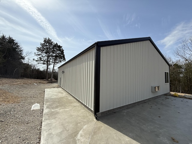 view of outbuilding featuring a wall mounted air conditioner