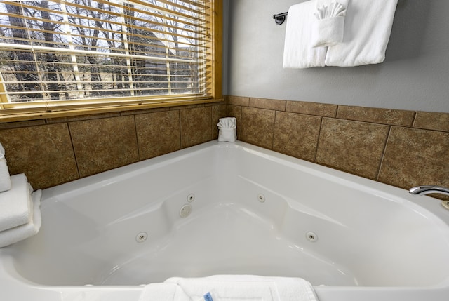 full bath with a jetted tub