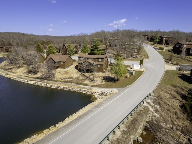 drone / aerial view with a residential view and a water view