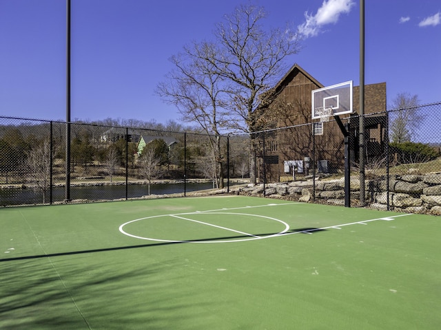 view of sport court featuring community basketball court and fence