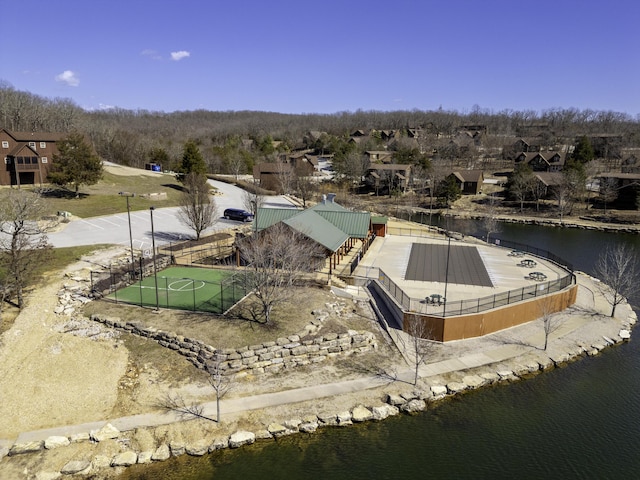 bird's eye view featuring a water view and a residential view