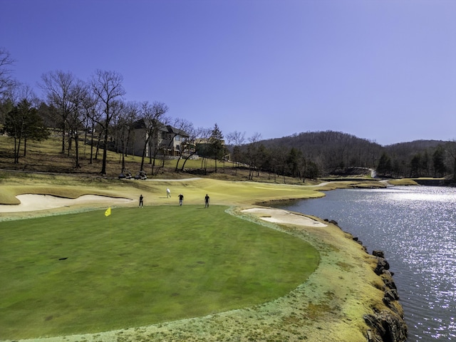 surrounding community with a water view