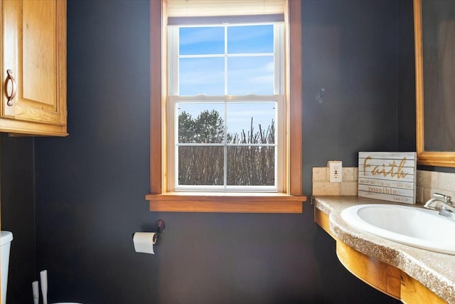 half bath featuring a sink and toilet