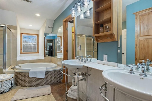 full bathroom featuring recessed lighting, a sink, a shower stall, a bath, and tile patterned floors