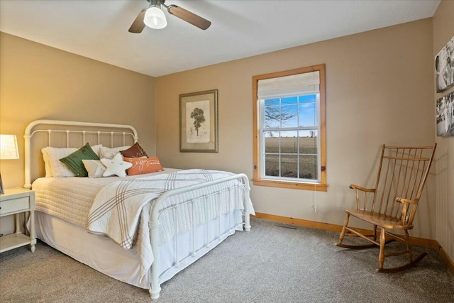 bedroom featuring ceiling fan, carpet, and baseboards