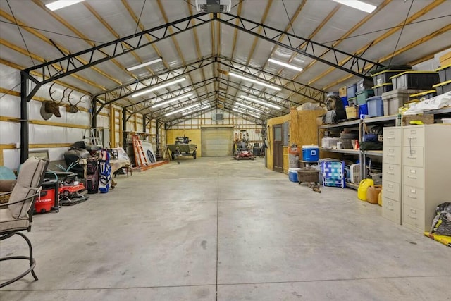 garage with a garage door opener and metal wall