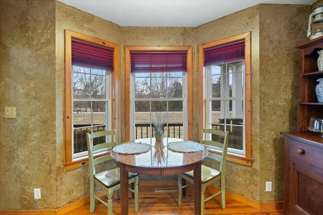 dining room with wood finished floors