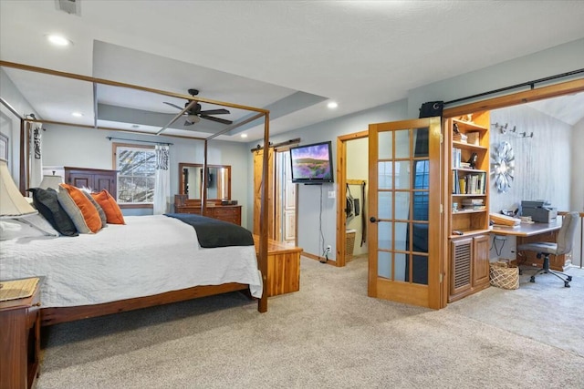 bedroom featuring carpet floors, visible vents, a raised ceiling, and recessed lighting