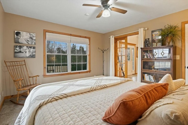 bedroom with carpet, ceiling fan, and baseboards