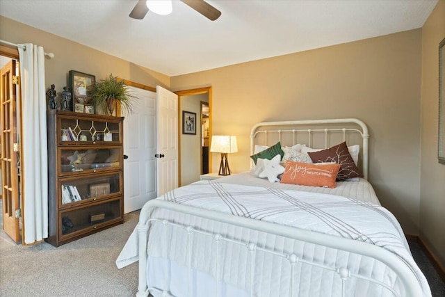 carpeted bedroom featuring ceiling fan