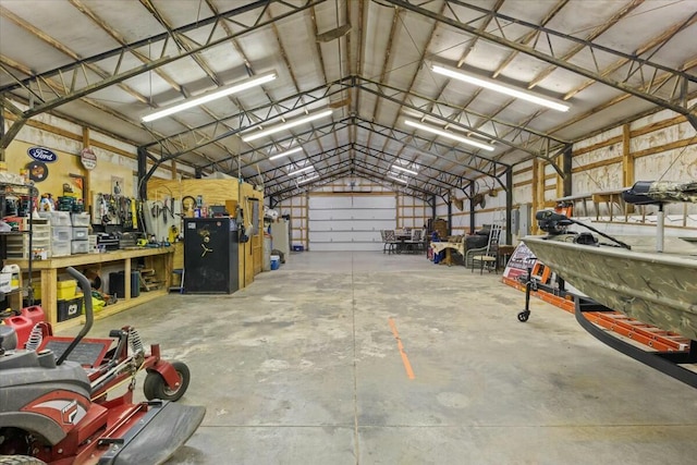 garage with a workshop area and metal wall