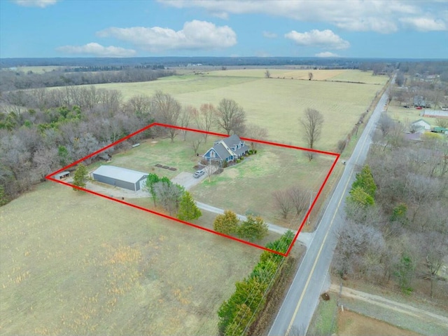 birds eye view of property with a rural view