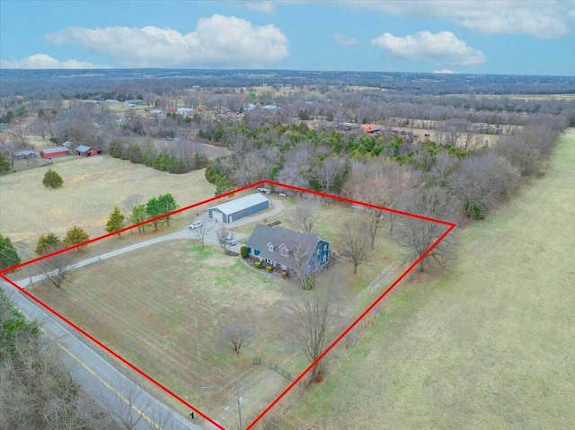 birds eye view of property with a rural view