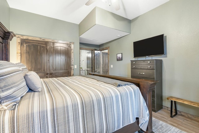 bedroom with baseboards and wood finished floors