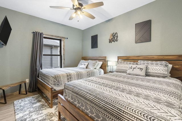 bedroom featuring ceiling fan and wood finished floors