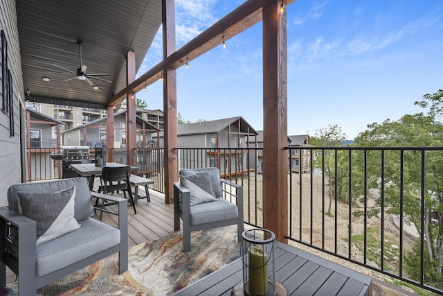 deck featuring ceiling fan and a grill