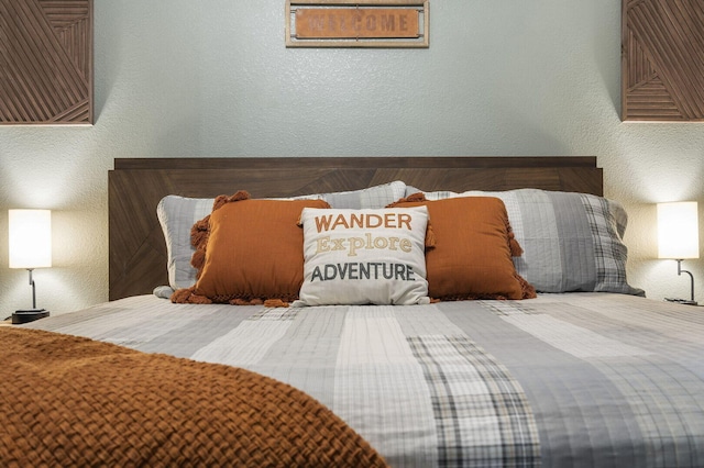 bedroom featuring a textured wall