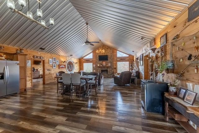 80 Serenity Ct, Gepp, AR 72538 - dining space with dark wood-style floors, high vaulted ceiling, a ceiling fan, and a stone fireplace