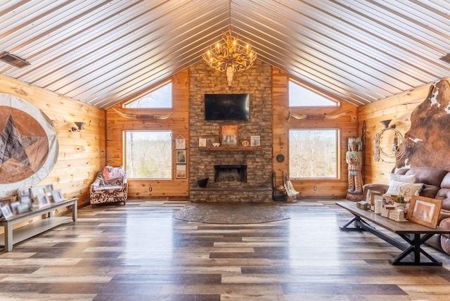 80 Serenity Ct, Gepp, AR 72538 - living area with a wealth of natural light, wood finished floors, a fireplace, and an inviting chandelier