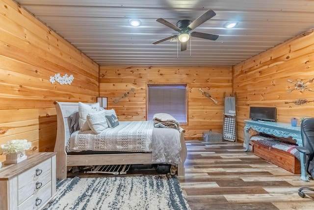 80 Serenity Ct, Gepp, AR 72538 - bedroom with wooden walls, a ceiling fan, and wood finished floors