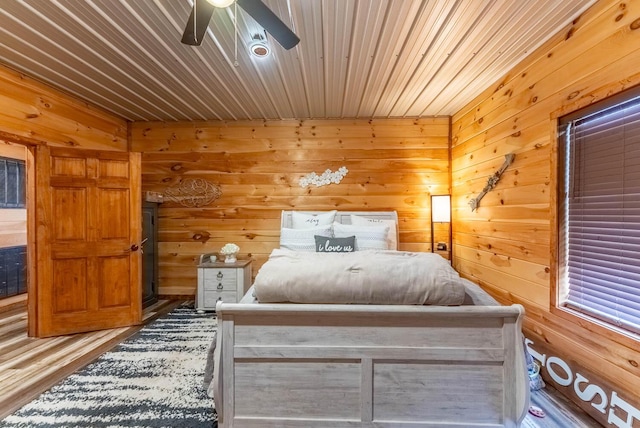 80 Serenity Ct, Gepp, AR 72538 - bedroom featuring wood walls, a ceiling fan, and wood finished floors