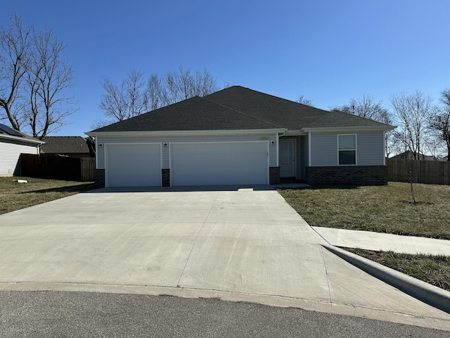 ranch-style home featuring an attached garage, fence, concrete driveway, and brick siding