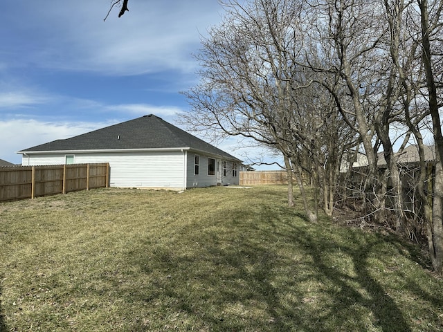 view of yard with a fenced backyard