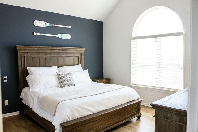 280 Woodland Dr Unit 2D, Branson, MO 65616 - bedroom featuring lofted ceiling, wood finished floors, and baseboards