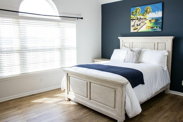 280 Woodland Dr Unit 2D, Branson, MO 65616 - bedroom featuring wood finished floors and baseboards