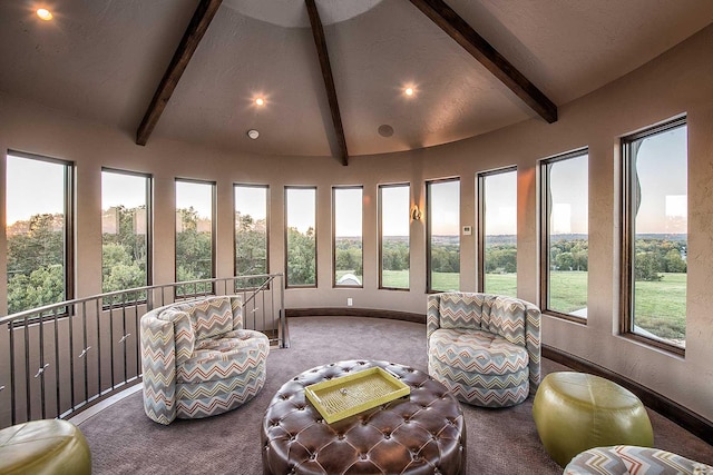 sunroom featuring vaulted ceiling with beams