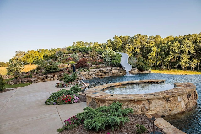 view of home's community featuring a water view