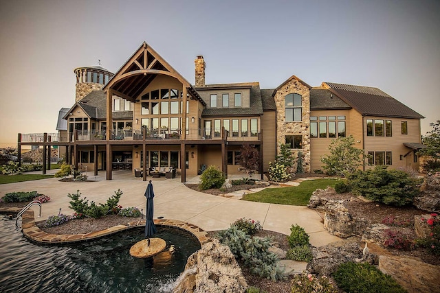 exterior space with a chimney and a patio area