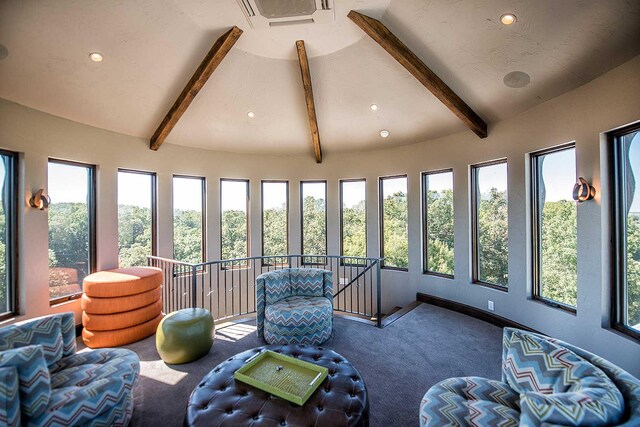 sunroom / solarium featuring visible vents and lofted ceiling with beams