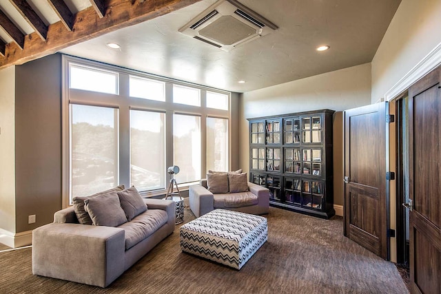 sitting room with baseboards, dark colored carpet, and recessed lighting