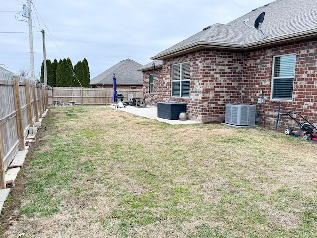 view of yard featuring a patio, cooling unit, and a fenced backyard