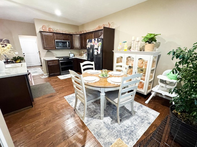 dining area with dark wood-type flooring